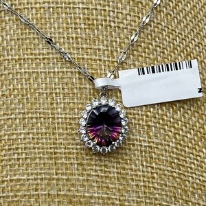 Genuine Concave Cut Mystic Quartz surrounded by white topaz halo. With 18” chain